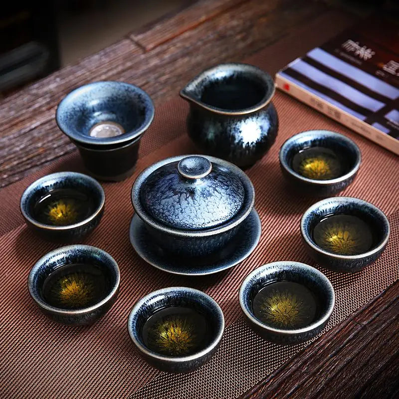 Glacier Jian Zhan Tenmoku tea set with a matching teapot and cups in a blue crystalline glaze