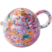 Théière en émail doré à motif floral 
