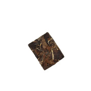 Compressed block of tea leaves from Fuding White Tea, aged Shoumei brick tea