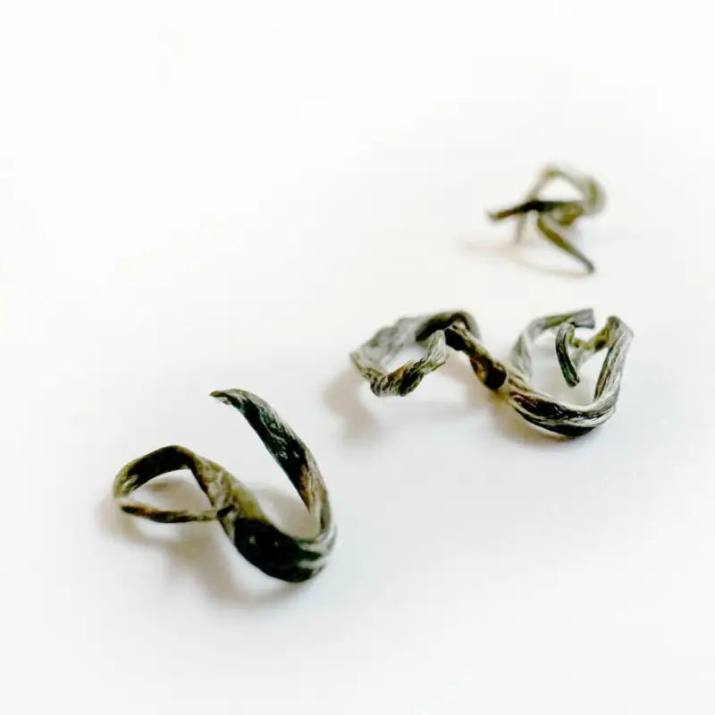 Rolled green tea leaves of Biluochun Green Tea with floral and fruity aroma