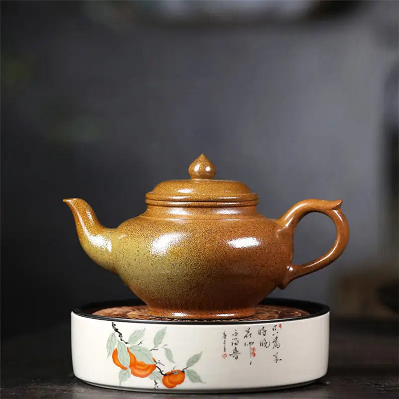 Ceramic Amber Flow Yixing Duanni Teapot with rounded handle and decorative base