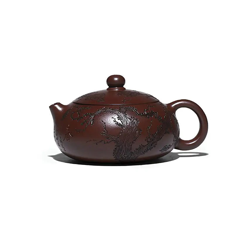 Brown ceramic teapot with etched tree design from Ancient Plum Tree Yixing Zisha collection