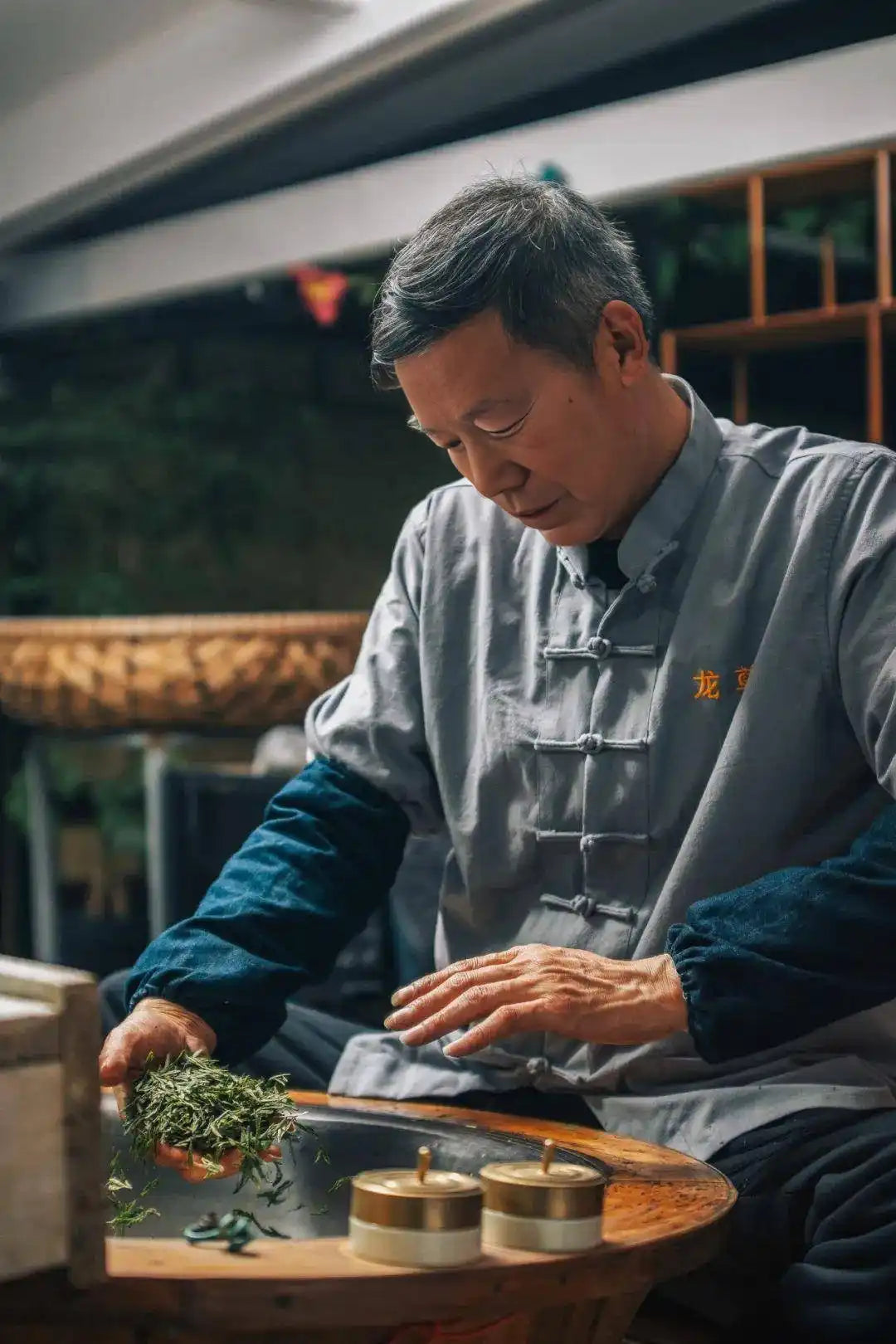 Asian man preparing tea.
