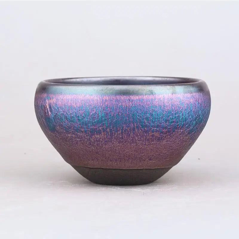 Iridescent purple and blue ceramic bowl from the Aurora Jian Zhan Cup collection