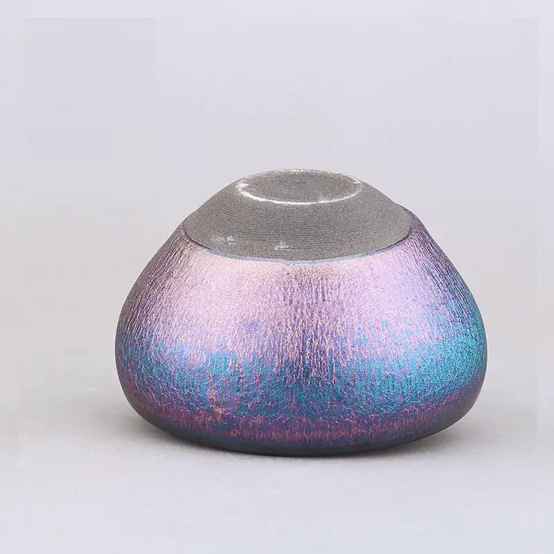 Iridescent rounded ceramic container from the Aurora jian zhan cup collection