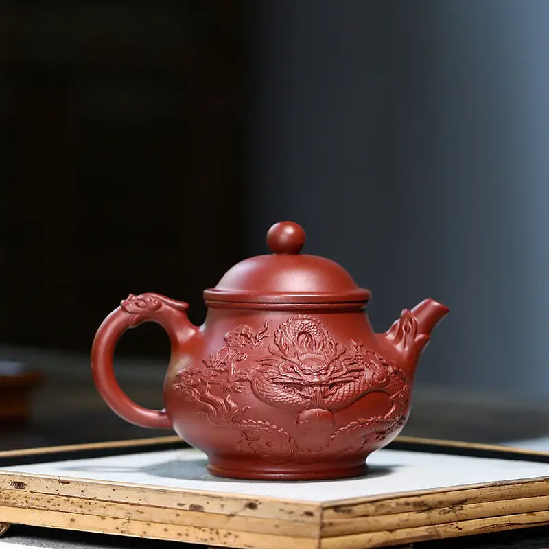 Reddish-brown teapot with dragon relief, perfect for Gongfu tea, Auspicious Dragon masterpiece