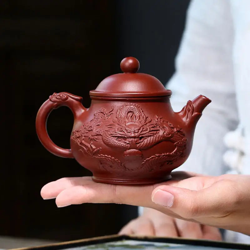 Reddish-brown clay teapot with dragon relief from Auspicious Dragon jiashui zitao masterpiece for gongfu tea