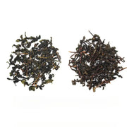 Two piles of dried authentic Anxi Tie Guan Yin oolong tea leaves for red-heart varietals