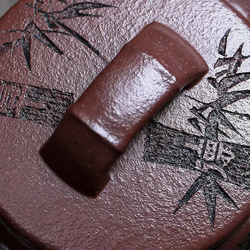 Brown ceramic lid with handle for Bamboo Elegance Yixing Zisha Teapot featuring hand-carved bamboo