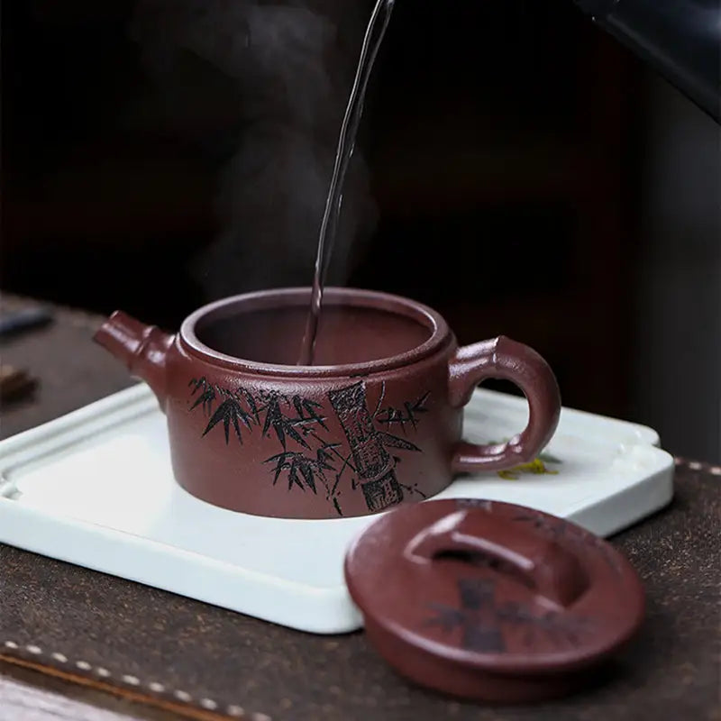 Brown ceramic Yixing Zisha teapot with hand-carved bamboo design from Bamboo Elegance collection