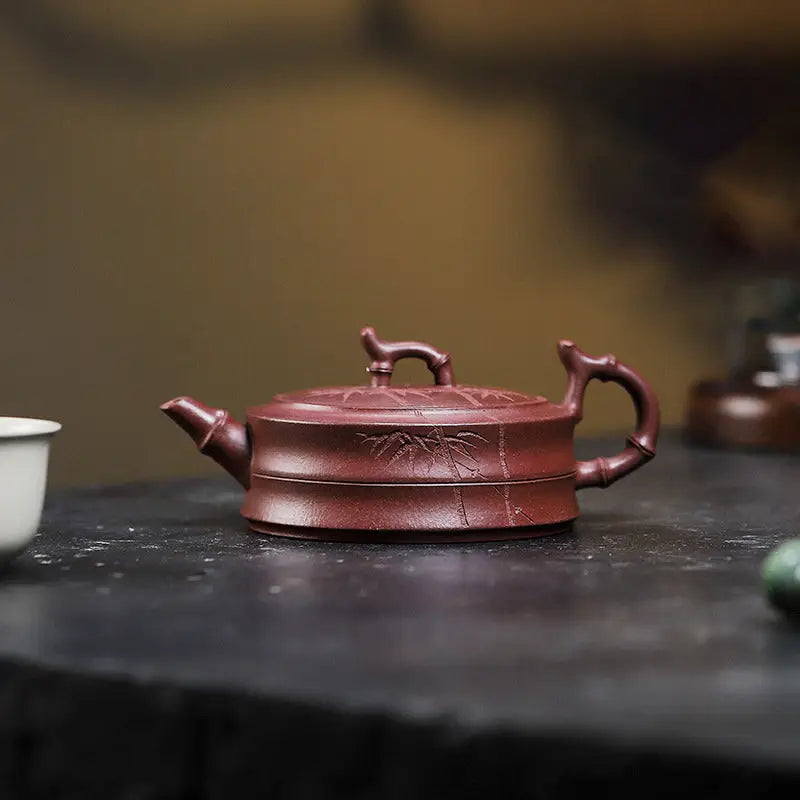 Maroon Yixing Zisha teapot with hand-carved bamboo pattern in Bamboo Grove design