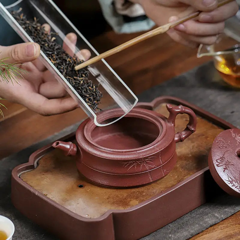 Yixing Zisha reddish-brown teapot with hand-carved bamboo pattern from Bamboo Grove