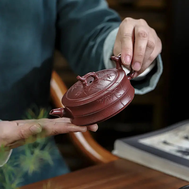 Reddish-brown Yixing Zisha teapot with hand-carved bamboo pattern from Bamboo Grove