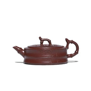 Maroon ceramic Yixing Zisha teapot with hand-carved bamboo pattern from Bamboo Grove