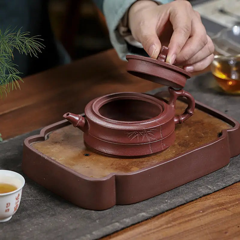 Maroon Yixing Zisha teapot with hand-carved bamboo pattern from Bamboo Grove