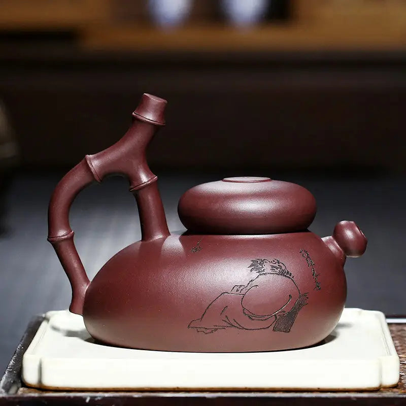 Maroon Yixing Zisha teapot with bamboo handle from Bamboo Path Gongfu Tea Set