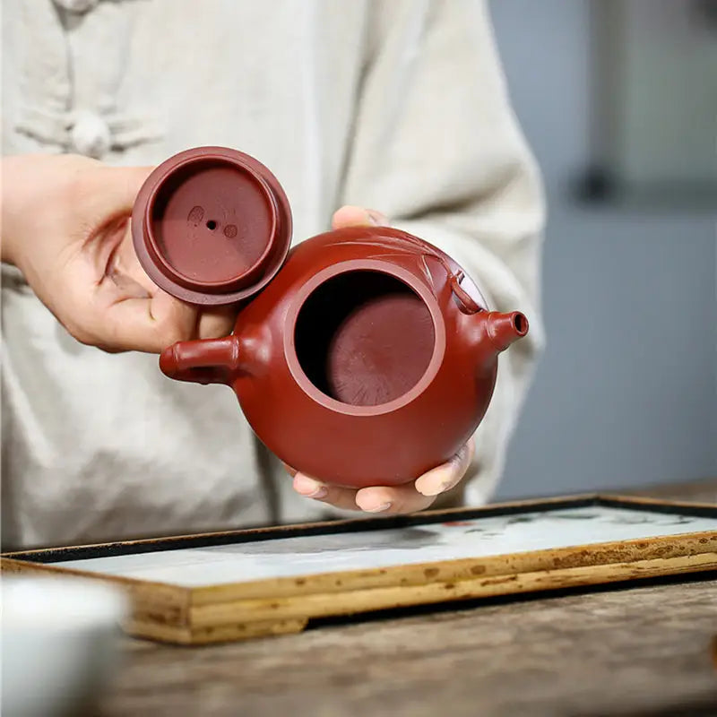 Reddish-brown ceramic teapot with lid from Bamboo Segment, perfect for tea sets