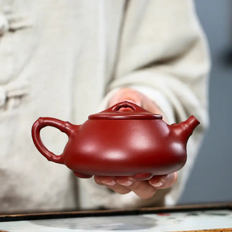 Reddish-brown clay teapot from Bamboo Segment, perfect for traditional tea sets and mugs