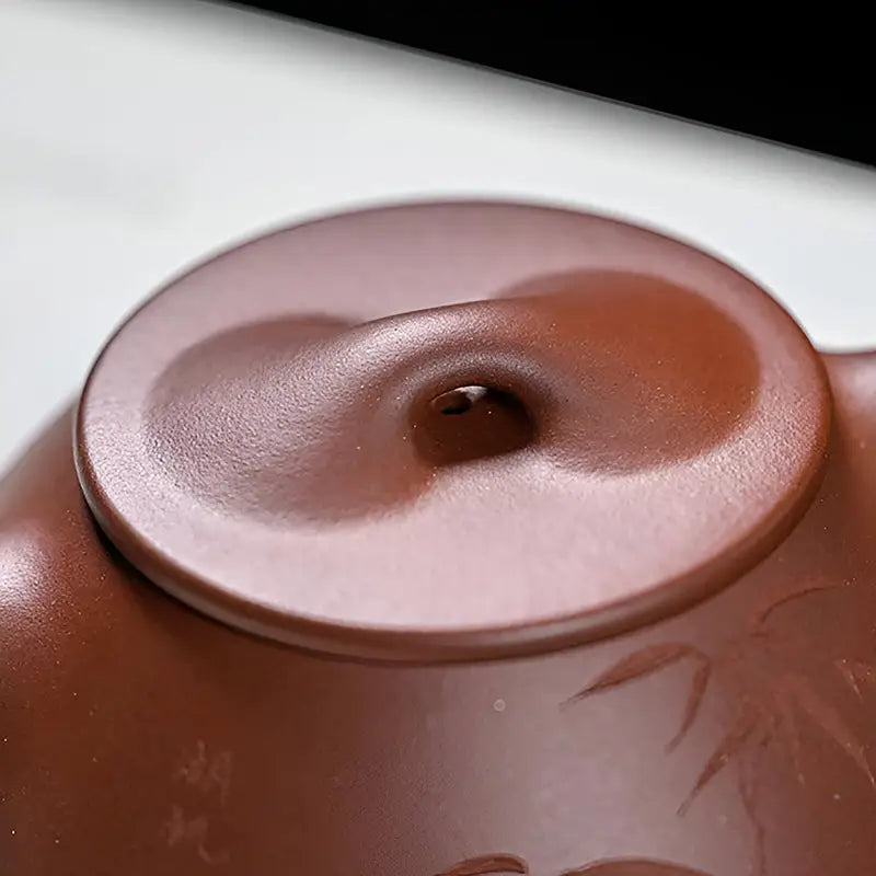 Brown ceramic teapot lid with a hole for Bamboo Whisper yixing zisha teapot