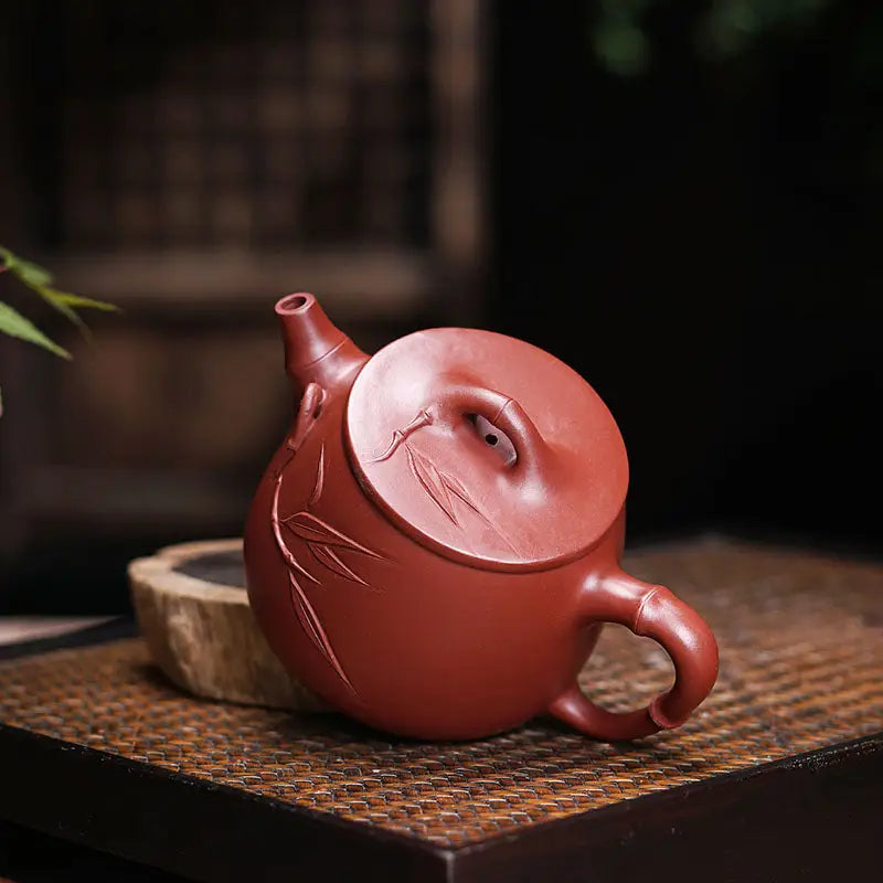 Reddish-brown ceramic teapot with carved bamboo leaf details from Bamboo Zen Harmony collection