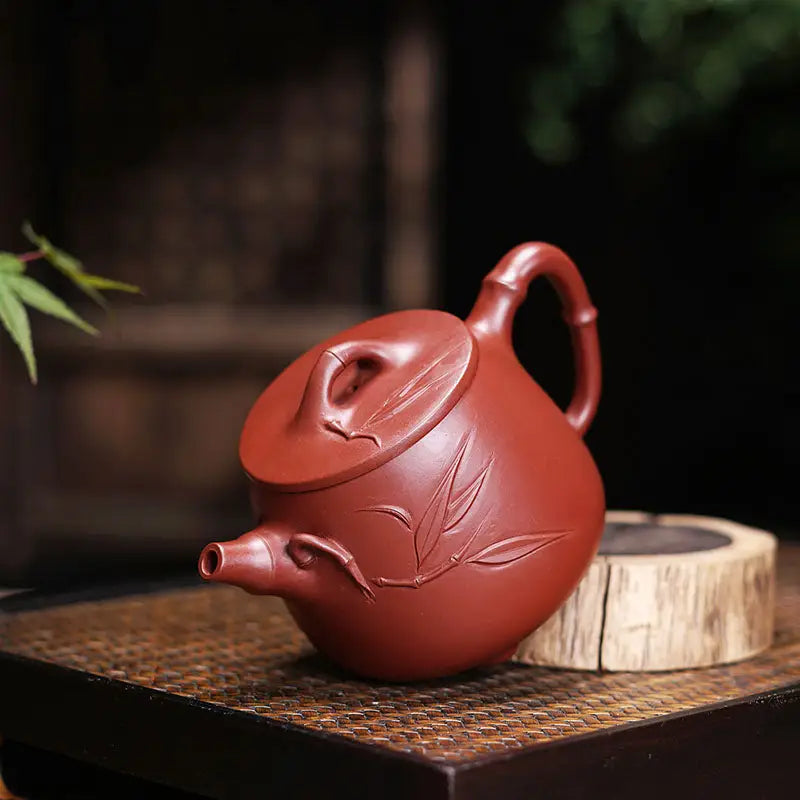 Reddish-brown ceramic teapot with bamboo-shaped handle and spout for Bamboo Zen harmony