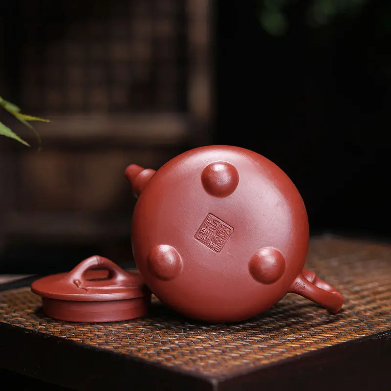 Reddish-brown ceramic teapot with lid from Bamboo Zen Harmony featuring carved bamboo design