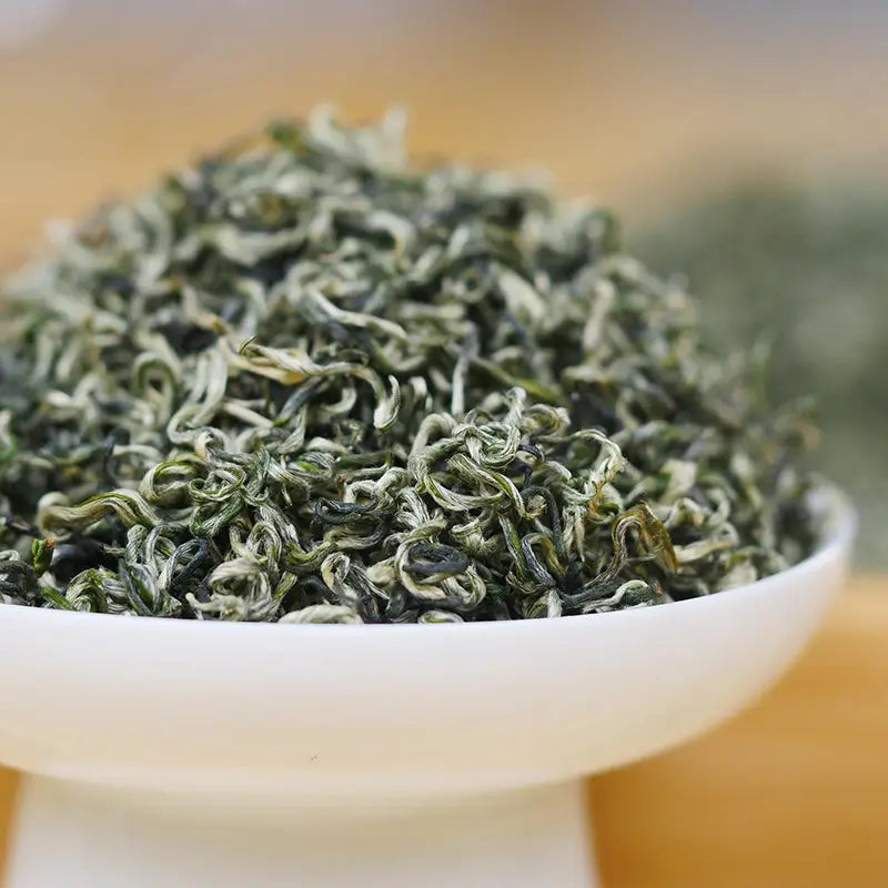 Bi Luo Chun Green Tea Leaves in a Bowl for Perfect Tea Sets and Mug Brewing