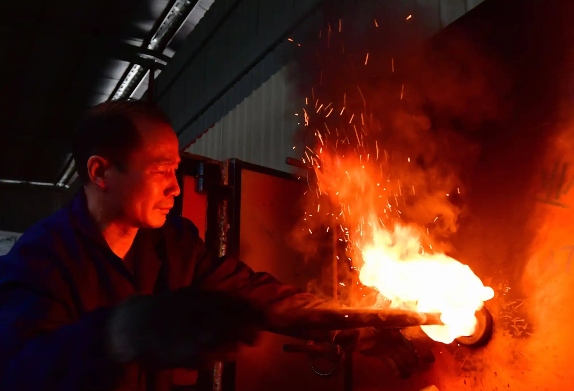 Blacksmith working with fire.