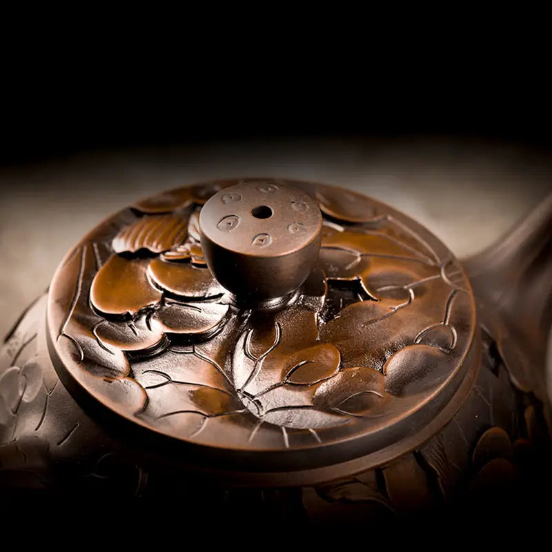Ornate brown teapot lid from Bloom II jianshui Zitao teapot showcasing modern purple clay design