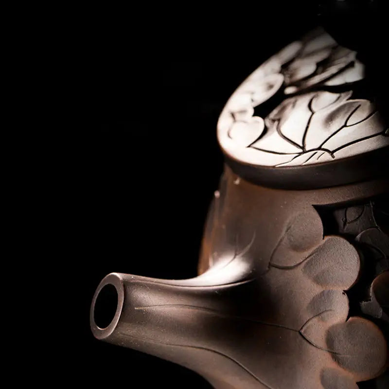 Ornate metal teapot from Bloom II featuring a jianshui zitao teapot design and purple clay modern tea craftsmanship