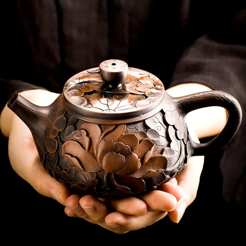 Ornate brown jianshui zitao teapot with floral carvings from Bloom II purple clay modern tea collection