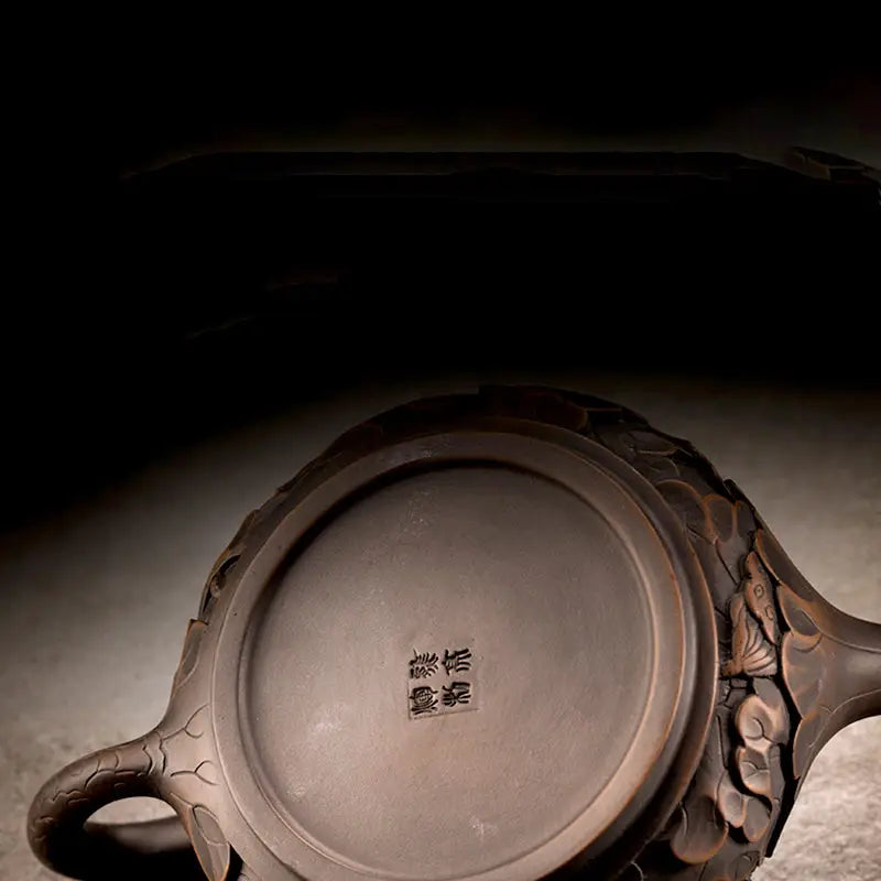 Ornate brown jianshui zitao teapot from Bloom II with modern purple clay zitao teapot design