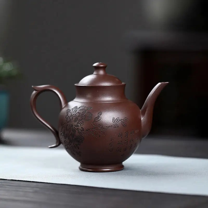 Brown ceramic Teapot with floral engravings from Blooming Scroll in Yixing Zisha Zini Clay