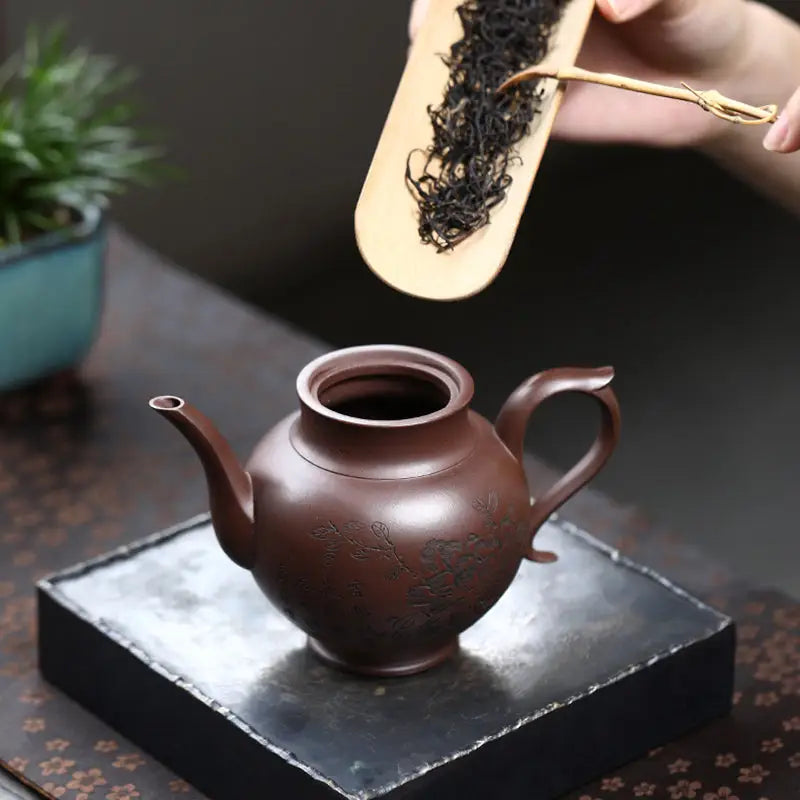 Brown ceramic teapot from Blooming Scroll made of Yixing Zisha Zini clay for brewing tea