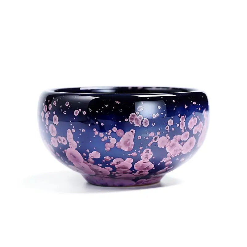Blue ceramic Blossom Jian Zhan bowl with pink crystalline glaze, inspired by spring petals for tea masters
