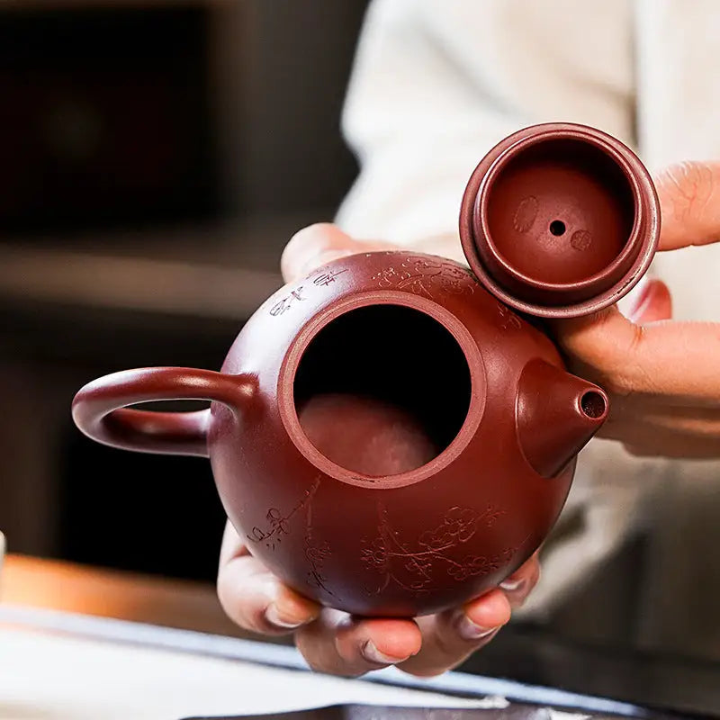 Maroon Yixing Zisha Blossom Verse teapot with open lid for tea enthusiasts