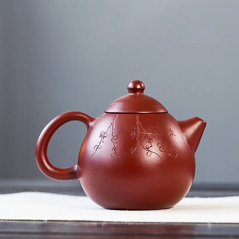 Red-brown Blossom Verse Yixing Zisha teapot with floral etching for classic tea brewing