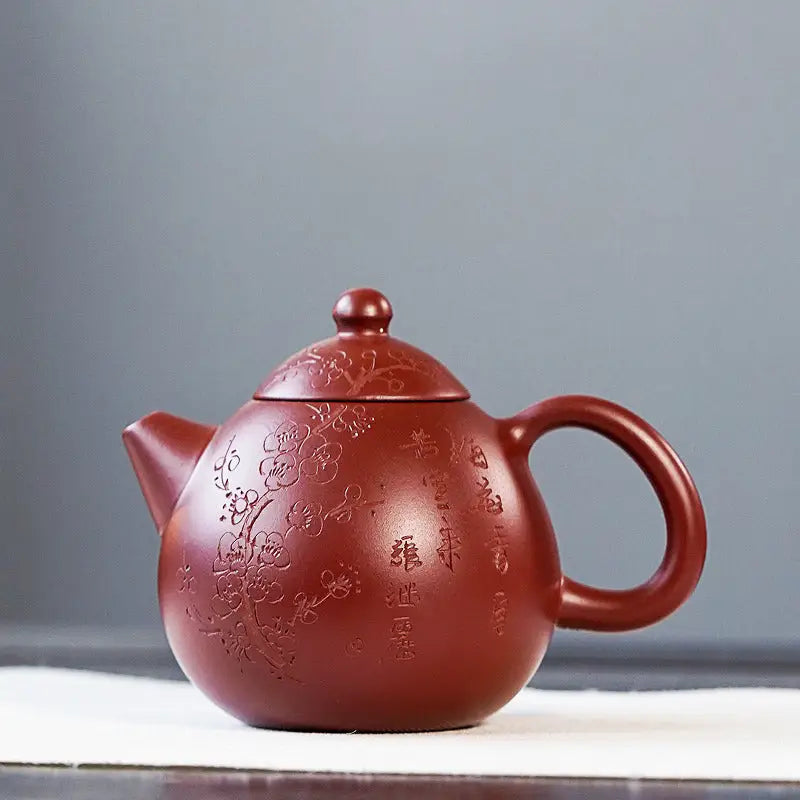 Maroon Yixing Zisha Blossom Verse ceramic teapot with floral and text designs