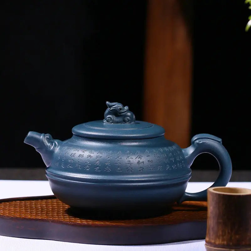 Blue-gray ceramic Yixing teapot with dragon handle, featuring a rare cobalt glaze, named Blue Poem
