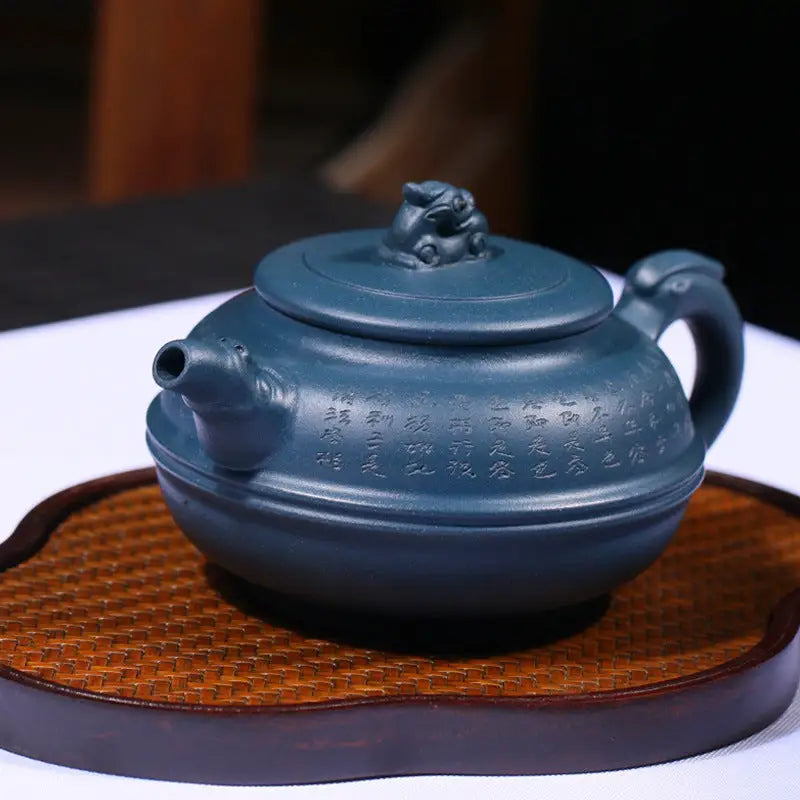 Azure guardian Blue Poem Yixing teapot with frog-shaped lid showcasing rare cobalt ceramics