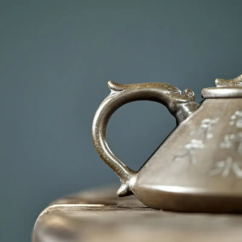 Ornate pewter teapot with tribal dragon motif in Bronze Dragon collection