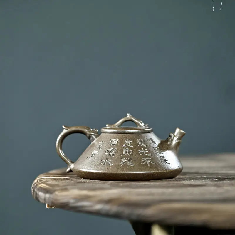 Ornate bronze dragon teapot with tribal dragon motif, ideal as Yixing Zisha collectible