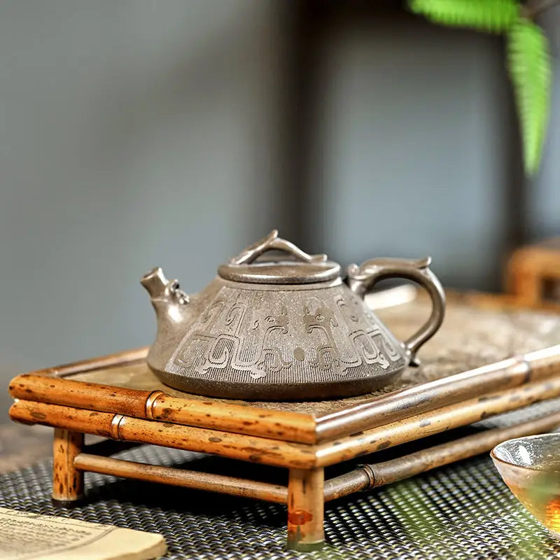 Ornate bronze dragon teapot with tribal dragon motif and Yixing Zisha craftsmanship