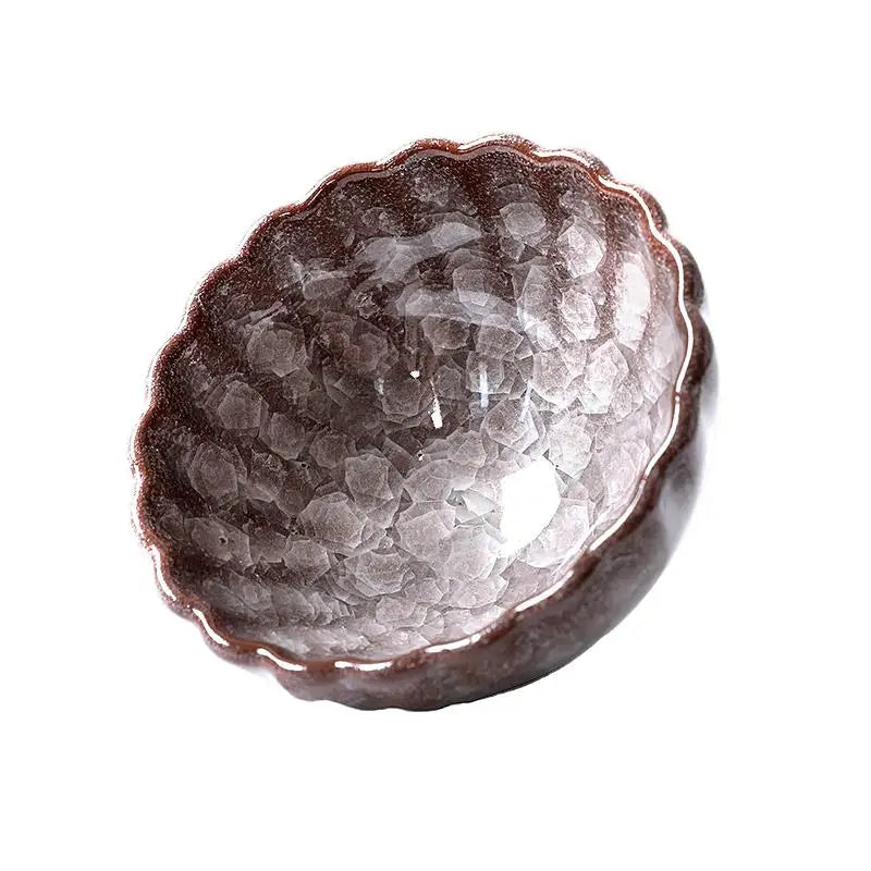 Textured iridescent decorative bowl with glossy crystal glaze by Jian Zhan featuring crackled minerals