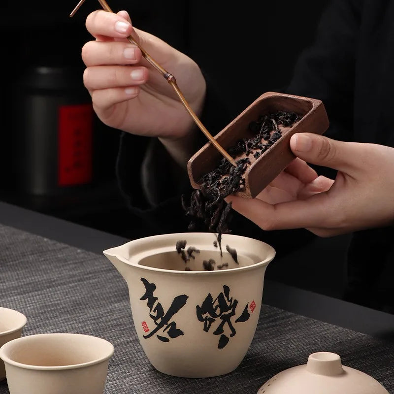 Coarse stoneware travel tea set with calligraphy teapot, two cups and grey case – photo 2