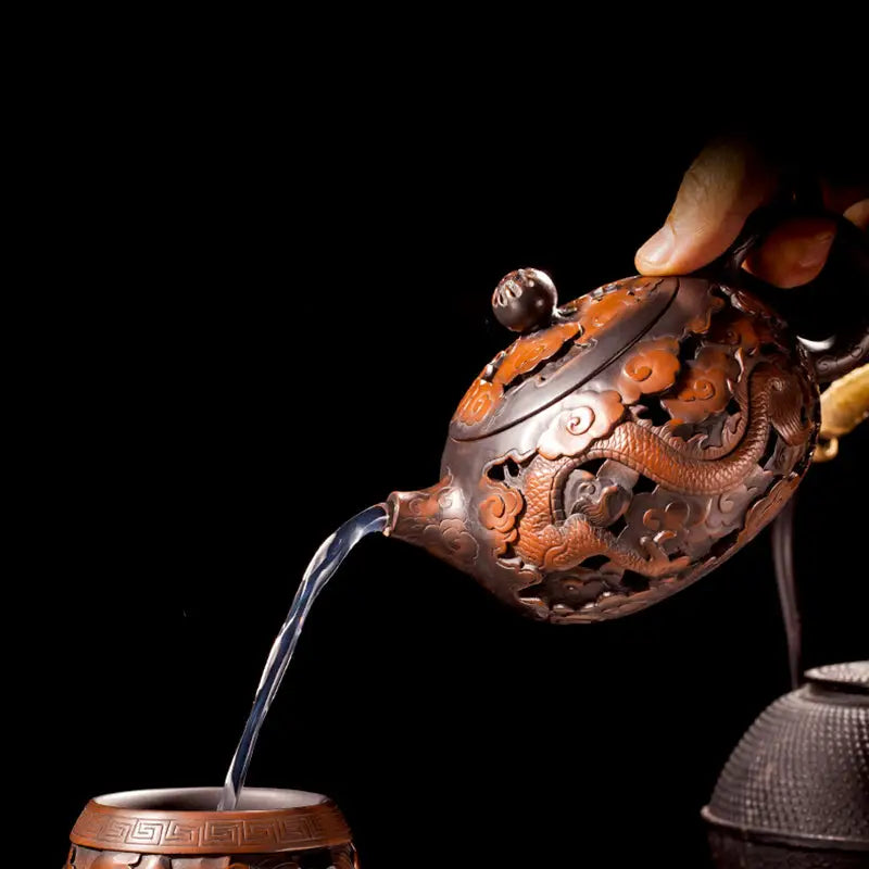 Ornate Carving Dragon jianshui zitao teapot with hand-carved dragon pouring water
