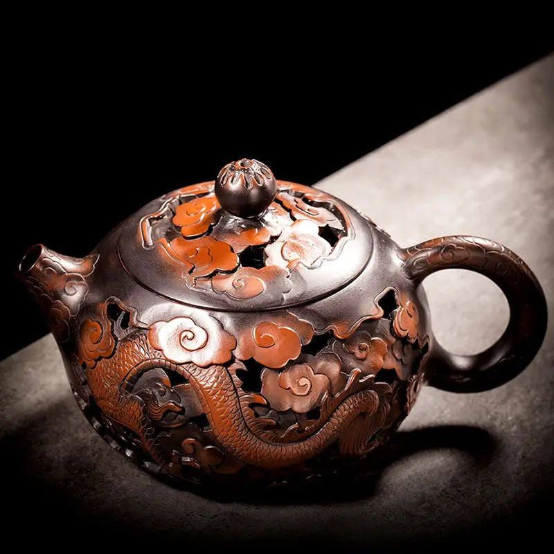 Ornate dark brown Jianshui Zitao teapot with hand-carved dragon and cloud designs in Carving Dragon