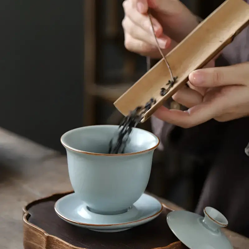 Light blue kiln gaiwan with crackle glaze, saucer, and lid for gongfu tea brewing