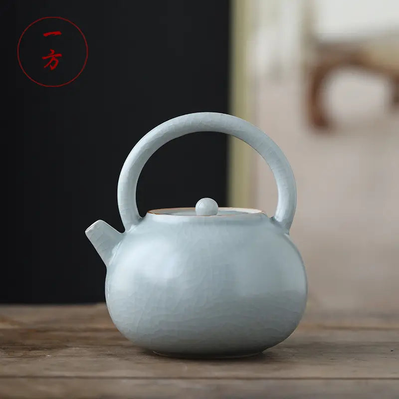 Light blue ceramic teapot with crackle glaze and celadon ru kiln finish