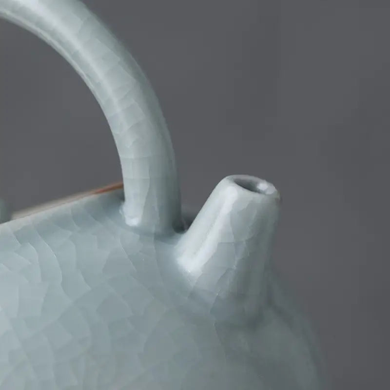 Pale blue Celadon Ru Kiln crackle glaze teapot showcasing tianqing glaze craftsmanship